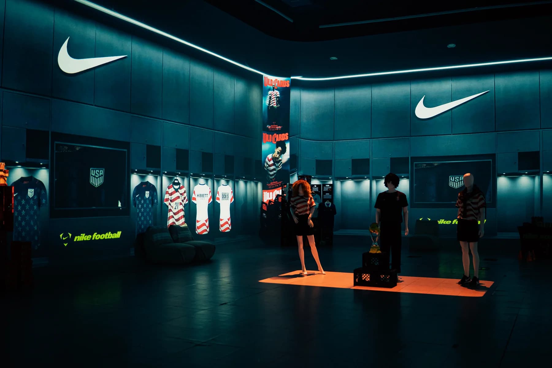 Wide view of the Nike activation with illuminated walls and jersey displays